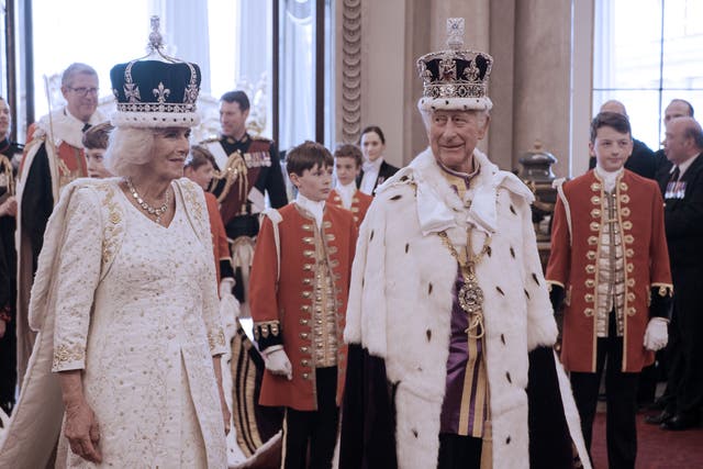 <p>King Charles III and Queen Camilla in coronation gowns and crowns at Buckingham Palace on the big day</p>